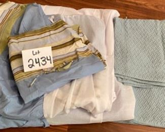 Lot 2434. $135.00. Day bed set includes: 2 grass bolsters, day bed quilt, 3 shams, and 1 daybed custom skirt with navy lining and grasscloth-ish. Later add: 2 additional matching day bed skirts (to quilt), 2 regular pillow case and 2 quilted pillow shams.
