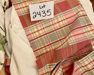 Lot 2435. $175.00. Such a good deal! Large Custom Bedding Set (with window treatments). 4 roman shades or panels (can't tell on 2 of them), window valance, 2 plaid pillows with pompoms, 1 throw pillow, 1 full duvet with insert (reverse to butter yellow), 1 full bedskirt, 2 custom pillows.