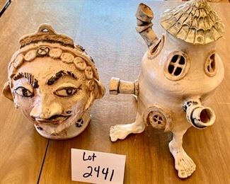Lot 2441. $80.00. 2 Artist Made Studio Pottery Sculptures. One is an interesting head, the other is a surrealist house, with a detached top. Add some interest and whimsy to your home! The Head is 9" tall.