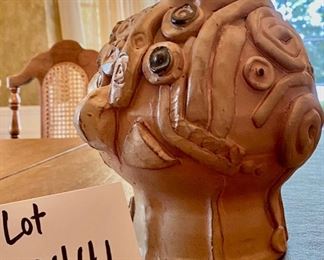 Lot 2441. $80.00. 2 Artist-Made Studio Pottery Sculptures. One is an interesting head, the other is a surrealist house, with a detached top. Add some interest and whimsy to your home! The Head is 9" tall.