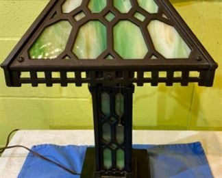 Lot 2449. $295.00. Fabulous Antique Green Slag Glass & Iron Parlor Lamp. Shade looks good, 2 glass pieces in the base have to be repositioned, and overall this lamp looks terrific