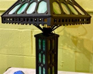 Lot 2449. $295.00. Fabulous Antique Green Slag Glass & Iron Parlor Lamp. Shade looks good, 2 glass pieces in the base have to be repositioned, and overall this lamp looks terrific