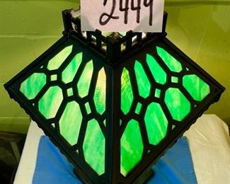 Lot 2449. $295.00. Fabulous Antique Green Slag Glass & Iron Parlor Lamp. Shade looks good, 2 glass pieces in the base have to be repositioned, and overall this lamp looks terrific