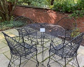 Lot 2299. Sunday Discounted Price: $550.00 FIRM. Was $795.00. Vintage Wire Outdoor Dining Set. Richard Porton Inc English Wire Table and 4 Robert Allen Furniture Co Wire Dining Chairs. Chairs have cool details (owner purchased set for a fortune from an Antique Shop). All pieces are in great condition. The chairs can definitely use a small cushion. A well crafted set, perfect for your garden party! Table: 40" dia, 28.5"h. Chairs: 35" back, 19" wide, 17" deep, 18: h