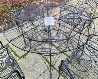 Lot 2299. Sunday Discounted Price: $550.00 FIRM. Was $795.00. Vintage Wire Outdoor Dining Set. Richard Porton Inc English Wire Table and 4 Robert Allen Furniture Co Wire Dining Chairs. Chairs have cool details (owner purchased set for a fortune from an Antique Shop). All pieces are in great condition. The chairs can definitely use a small cushion. A well crafted set, perfect for your garden party! Table: 40" dia, 28.5"h. Chairs: 35" back, 19" wide, 17" deep, 18: h