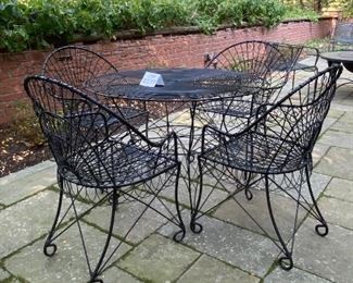 Lot 2299. Sunday Discounted Price: $550.00 FIRM. Was $795.00. Vintage Wire Outdoor Dining Set. Richard Porton Inc English Wire Table and 4 Robert Allen Furniture Co Wire Dining Chairs. Chairs have cool details (owner purchased set for a fortune from an Antique Shop). All pieces are in great condition. The chairs can definitely use a small cushion. A well crafted set, perfect for your garden party! Table: 40" dia, 28.5"h. Chairs: 35" back, 19" wide, 17" deep, 18: h