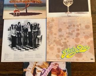 Lot 2522 $25.00 The Mix and Match 5 LP Collection. Great collection of classic groups including Fleetwood Mac, Steely Dan and Frampton.