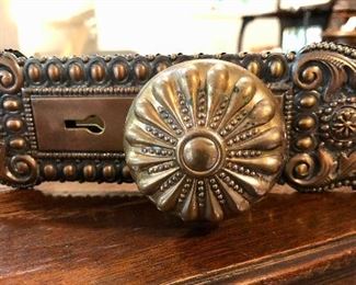 Lot 2322. $250.00. Antique Brass Door Knob and plate, a lighter metal doorknob (still old) and plate, 3 bar draft pulls or faucets? 2 have white pulls one has a black pull.