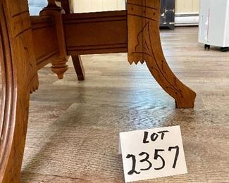 Lot 2357. $125.00. Small Oak Occasional Table from the Victorian Era. Matches an Easel shown in an earlier lot. Perfect for smaller spaces! 30"w x 22"d x 16" tall