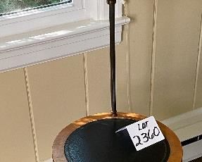 Lot 2360. $125.00. Unique Swivel Table Floor Lamp with semi-transparent pressed botanical shade (there are different flowers on 3 panes). Vintage. The tabletop is leather (I believe) and the base is brass. Well-made. The wood border on the table could use a little Old English, which should clean it up nicely. 15" dia table, 50" tall