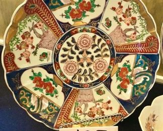 Lot 2384. $250.00. Possibly old Imari ware Japan Serving Platters and Bowls: 4 Platters/Plates (8.25" dia, 10.25" dia, 12" dia, 14" dia). The 12" dia is a scalloped edge platter/charger with a little different pattern but coordinates well. 2 vegetable bowls (7" dia each).