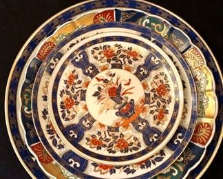 Lot 2384. $250.00. Possibly old Imari ware Japan Serving Platters and Bowls: 4 Platters/Plates (8.25" dia, 10.25" dia, 12" dia, 14" dia). The 12" dia is a scalloped edge platter/charger with a little different pattern but coordinates well. 2 vegetable bowls (7" dia each).