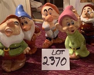 Lot 2370. $50.00. Set of Snow White's 7 dwarfs Ceramics. Bashful has a chip on the blue hat rim. Doc has a chip on nose.