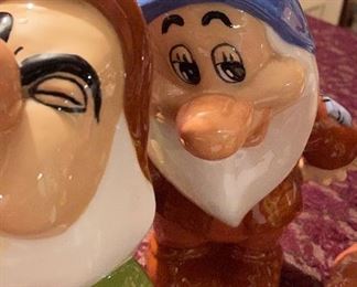 Lot 2370. $50.00. Set of Snow White's 7 dwarfs Ceramics. Bashful has a chip on the blue hat rim. Doc has a chip on nose.