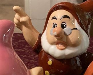 Lot 2370. $50.00. Set of Snow White's 7 dwarfs Ceramics. Bashful has a chip on the blue hat rim. Doc has a chip on nose.