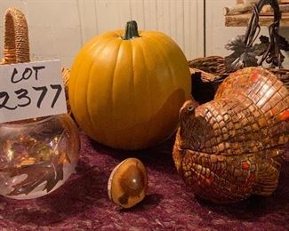 Lot 2377, $38.00. 1) Resin Pumpkin- great centerpiece, 2) Turkey cover gravy dish (adorable), 3) Grass Rose bowl w/leaf motif, 4) New Zealand Bottle Stopper made from a tree knot. 5) 2 Baskets that would be great for Fall decor!
