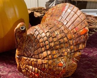 Lot 2377, $38.00. 1) Resin Pumpkin- great centerpiece, 2) Turkey cover gravy dish (adorable), 3) Grass Rose bowl w/leaf motif, 4) New Zealand Bottle Stopper made from a tree knot. 5) 2 Baskets that would be great for Fall decor!