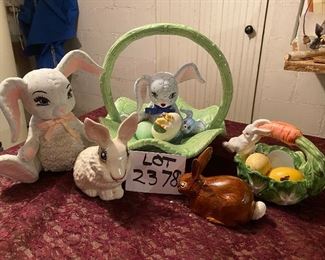 Lot 2378, $50.00. Big lot of Easter: cabbage basket w/ bunny; Brown Bunny; White cotton ball holder bunny; Bunny bank 9" tall; small bunny bank; tiny bunny
