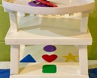 Lot 2452. $35.00. Vintage American Girl Doll Bitty Baby High Chair and Activity Table, with blocks and teething ring. My youngest daughter had one of the first Bitty Baby Dolls, as my sister in law worked for the Pleasant Company just over the border in Wisconsin. That doll went EVERYWHERE with her, clearly the best overpriced Pre-American Girl item we ever bought!