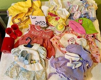 Lot 2453. $95.00. Bitty Gets a New Wardrobe. American Girl Doll Bitty Baby Lot of Outfits (7 outfits). Easter Set, Valentine, Birthday, Circus, Rain Gear, Swimsuit, Dress.