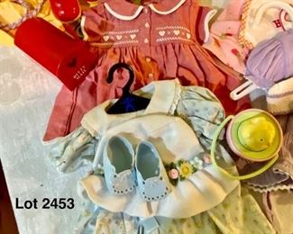Lot 2453. $95.00. Bitty Gets a New Wardrobe. American Girl Doll Bitty Baby Lot of Outfits (7 outfits). Easter Set, Valentine, Birthday, Circus, Rain Gear, Swimsuit, Dress.