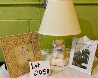 Lot 2458 (Not the number the card says, sorry). $38.00. Cherub Night Light (charpente), 2 white picture frames. The smaller one is cast iron (instant family!)