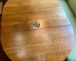 Lot 2497. $250.00. Kitchen Table (just the table, no chairs or cushions). Oak 4 leg table, 1 leaf Oval. 48"w x 58"l x 30"t. The leaf is 16.5"w.