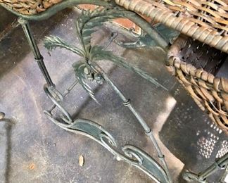 Lot 2498B: $90.00. each set of two. We have 2 sets of 2 tables. Vintage Wicker Nesting Tables: Wicker (has light wear, commensurate with age, , with wrought iron base with palm tree designs. Tables have 2 drawers and stack to nest. "Larger: 26""w x 16""d x 24""t & Smaller: 21""w x 14""d x 19""t"