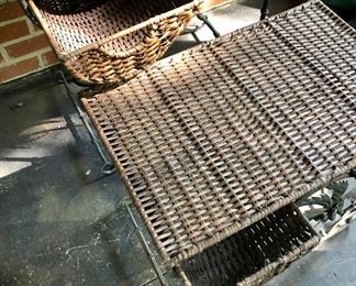 Lot 2498A: $90.00. We have 2 sets of 2 tables. Vintage Wicker Nesting Tables: Wicker (has some imperfections), with a wrought iron base with palm tree designs. Tables have 2 drawers and stack to nest. "Larger: 26"w x 16"d x 24"t & Smaller: 21"w x 14"d x 19"t"