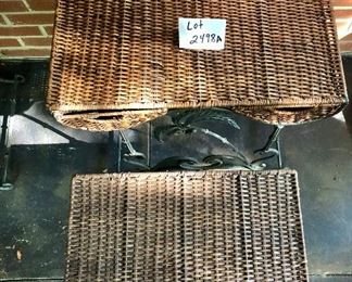 Lot 2498A: $90.00. each set of two. We have 2 sets of 2 tables. Vintage Wicker Nesting Tables: Wicker (has light wear, commensurate with age, , with wrought iron base with palm tree designs. Tables have 2 drawers and stack to nest. "Larger: 26""w x 16""d x 24""t & Smaller: 21""w x 14""d x 19""t"