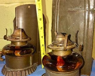 Lot 2463. $55.00. 3 vintage wall sconces (we have clear chimneys for these 3) oil lamps. 2 vintage amber glass handy oil lamp w/ reflector, hangs on the wall. And one brass eagle.