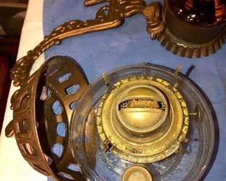 Lot 2463. $55.00. 3 vintage wall sconces (we have clear chimneys for these 3) oil lamps. 2 vintage amber glass handy oil lamp w/ reflector, hangs on the wall. And one brass eagle.