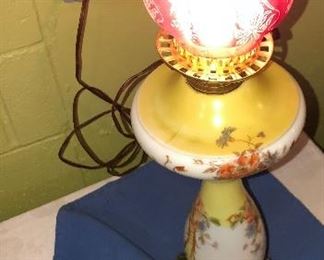 Lot 2462. $48.00. Vintage Table Lamp, Yellow, and White printed. Included sweet cranberry shade that we think would look lovely on this lamp! 19"tall to top of lamp (not a hurricane), x 7" wide