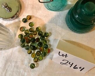 Lot 2464. $65.00. Vintage Bottles (8 pc) and vintage marbles. Lot Includes: Pike Dairy Cream Top with spoon bottle, 2 milk carafes, 1 green glass hinged bottle, 2 ball jars (1 with lid),