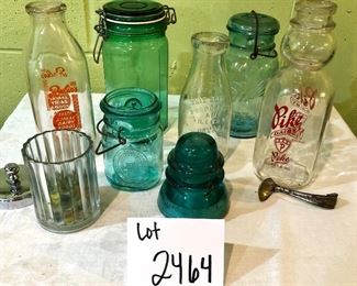 Lot 2464. $65.00. Vintage Bottles (8 pc) and vintage marbles. Lot Includes: Pike Dairy Cream Top with spoon bottle, 2 milk carafes, 1 green glass hinged bottle, 2 ball jars (1 with lid),