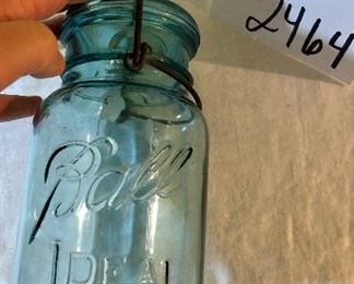Lot 2464. $65.00. Vintage Bottles (8 pc) and vintage marbles. Lot Includes: Pike Dairy Cream Top with spoon bottle, 2 milk carafes, 1 green glass hinged bottle, 2 ball jars (1 with lid),