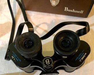 Lot 2467. $60.00. 1 pair of Bushnell Binoculars (Sportview) Insta Focus ST5890 and 1 pair of Binolux Universe No W6-91014 (case is damaged, but has a cool compass on it)
