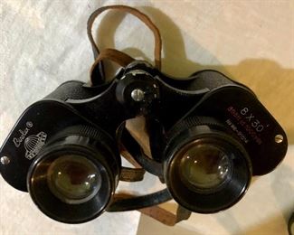 Lot 2467. $60.00. 1 pair of Bushnell Binoculars (Sportview) Insta Focus ST5890 and 1 pair of Binolux Universe No W6-91014 (case is damaged, but has a cool compass on it)