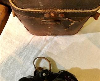Lot 2467. $60.00. 1 pair of Bushnell Binoculars (Sportview) Insta Focus ST5890 and 1 pair of Binolux Universe No W6-91014 (case is damaged, but has a cool compass on it)