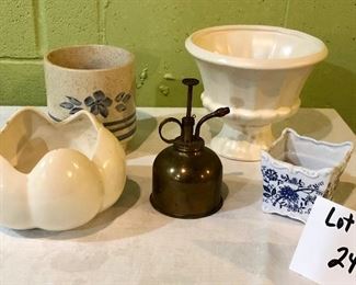 Lot 2468. $32.00. Sweet little planter lot. 1 Haeger Planter (#7-71), 1 white shell planter, White and blue planter, and small blue and white planter. Plus a small bronze water mister!