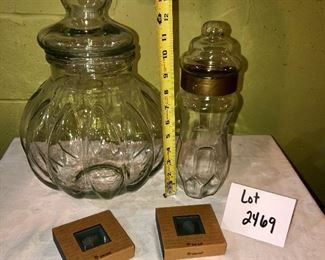 Lot 2469. $28.00. 2 sweet glass canisters (don't know the age of them) and 8 glass coasters.