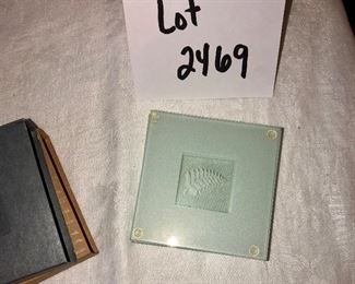 Lot 2469. $28.00. 2 sweet glass canisters (don't know the age of them) and 8 glass coasters.