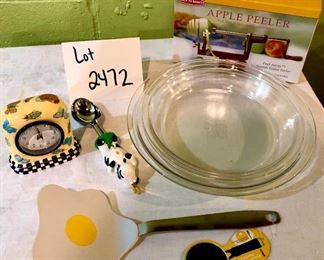 Lot 2472. $40.00. Ready for fall apples and pie making?! Apple Peeler, 3 glass pyrex pie pans (2 different sizes), 1 egg spatula, cow ice cream scoop, and cute clock.