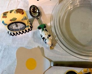 Lot 2472. $40.00. Ready for fall apples and pie making?! Apple Peeler, 3 glass pyrex pie pans (2 different sizes), 1 egg spatula, cow ice cream scoop, and cute clock.