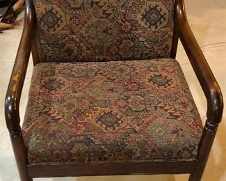 Lot 2476. $75.00. Upholstered Arm Chair with dark stained wood frame. This chair has been loved and it is in great shape. The arms have some rubbing! The chair has a southwest feel. 22.5" w x 33"t. seat: 18"d x 18"h