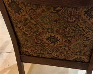 Lot 2476. $75.00. Upholstered Arm Chair with dark stained wood frame. This chair has been loved and it is in great shape. The arms have some wear, but that would be an easy fix! The chair has a southwest feel. 22.5" w x 33"t