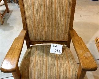 Lot 2477. $50.00. Interesting vintage Oak Rocker with striped upholstery. The wood details are incredible, but the fabric needs a good cleaning! Measures: 29"w x 41"t. seat: 19"d x 14"h