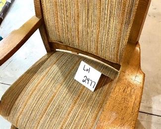 Lot 2477. $50.00. Interesting vintage Oak Rocker with striped upholstery. The wood details are incredible, but the fabric needs a good cleaning! Measures: 29"w x 41"t. seat: 19"d x 14"h