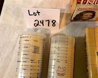 Lot 2478. $30.00. 2 Pampered Chef Measuring Cups (liquid and dry goods), The Kitchen Book, Vintage Crepe Maker (Oster Electric)
