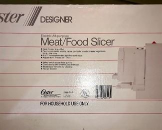 Lot 2480. $40.00. Small appliance lot. Oster Electric Meat/Food Slicer 34718, George Foreman Grilling Machine, Food Scale (Microweight), and MR. Coffee Grinder